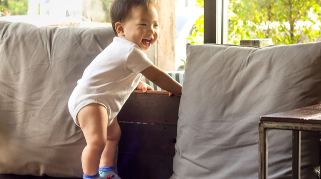 Baby standing store at 7 months