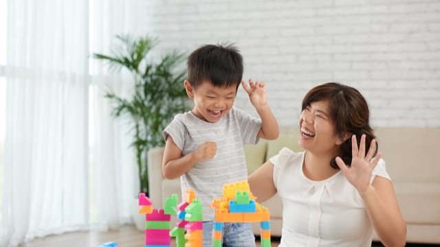 Mom and son plays together