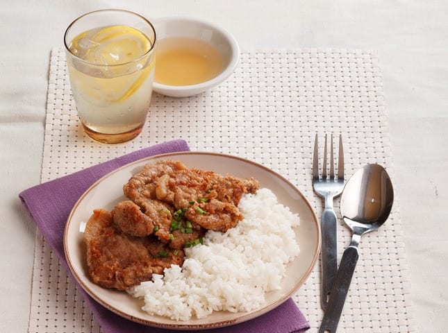 taiwanese pork chops on a plate with rice