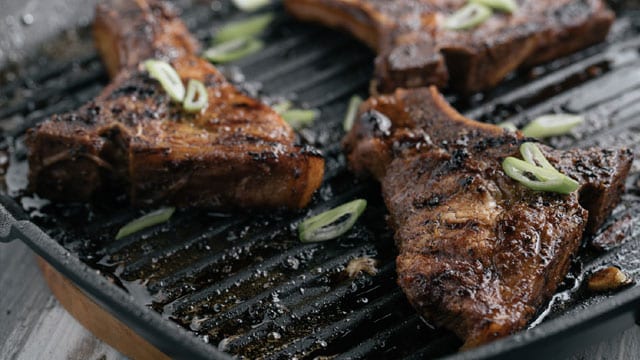 asian barbecue pork chops on a grill