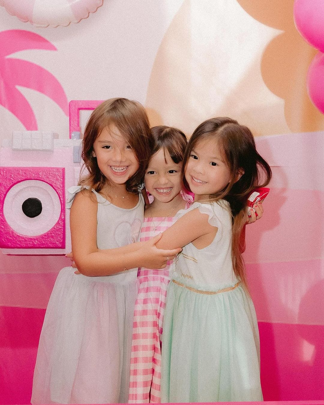 Thylane “Tili” Bolzico, Charlotte Arabella, and Dahlia Amélie Heussaff pose during Charlie's birthday party.