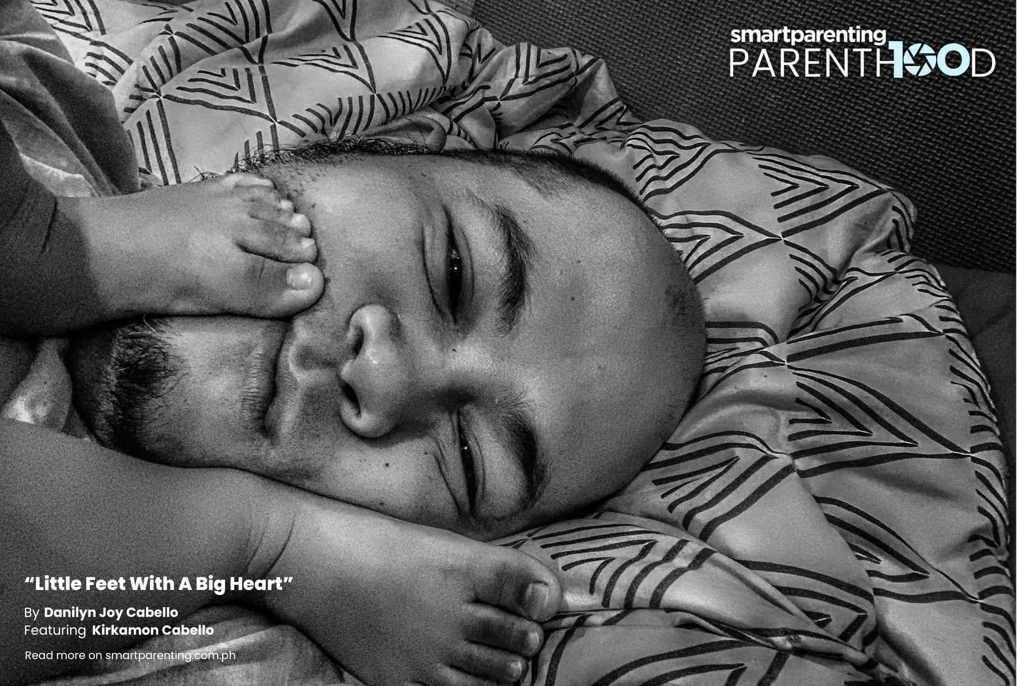a father with his baby's feet on his face