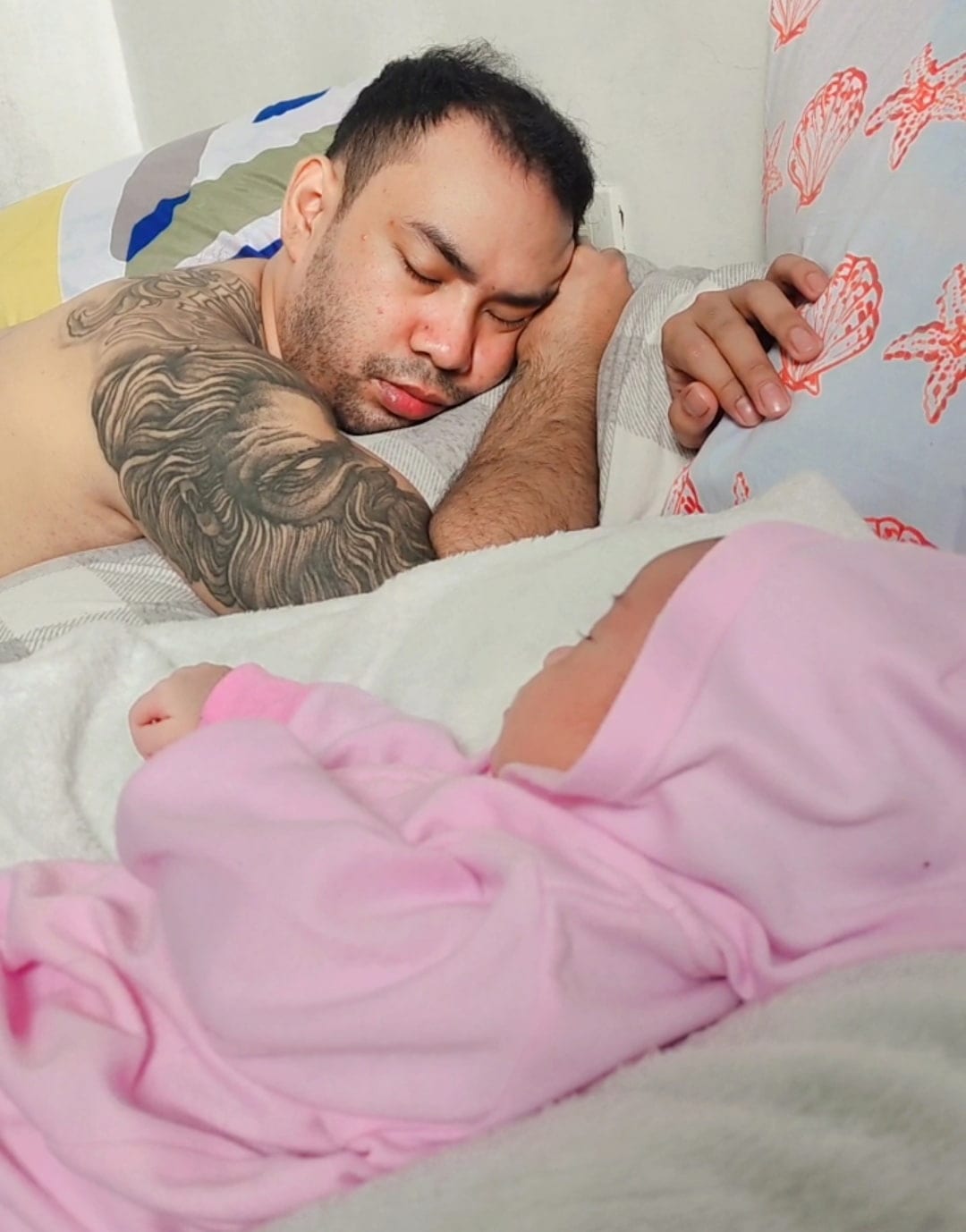 dad with sleeping baby