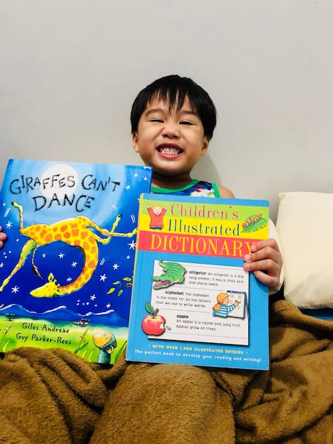 CHILD WITH WORKBOOKS