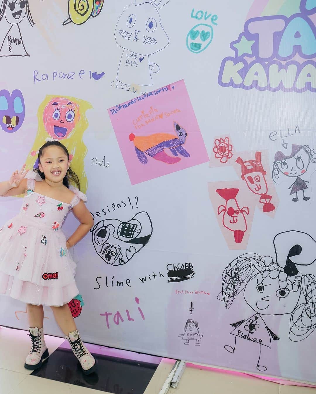 Tali and her doodle wall