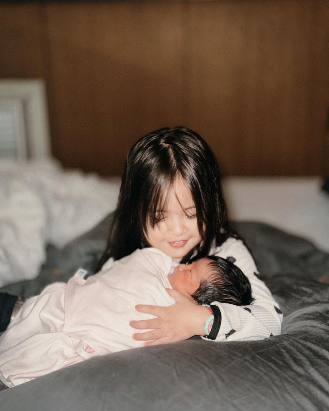 Sophie Albert and Vin Abrenica with their daughters.
