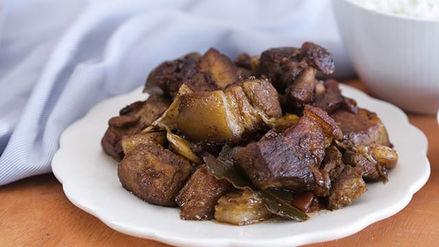 Adobong baboy na tuyo or dried adobo on a white plate