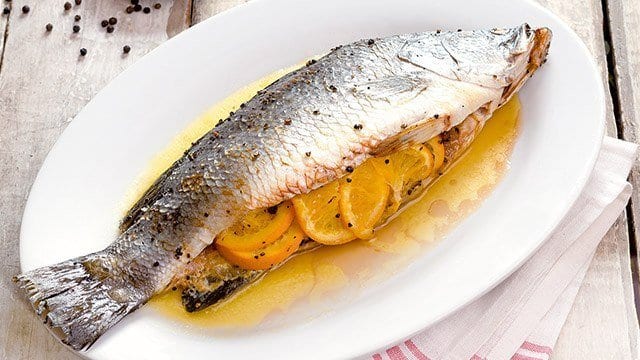 Baked Whole Fish stuffed with orange slices