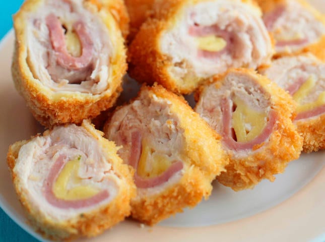 Chicken Cordon Bleu sliced to reveal cheese and ham rolled inside