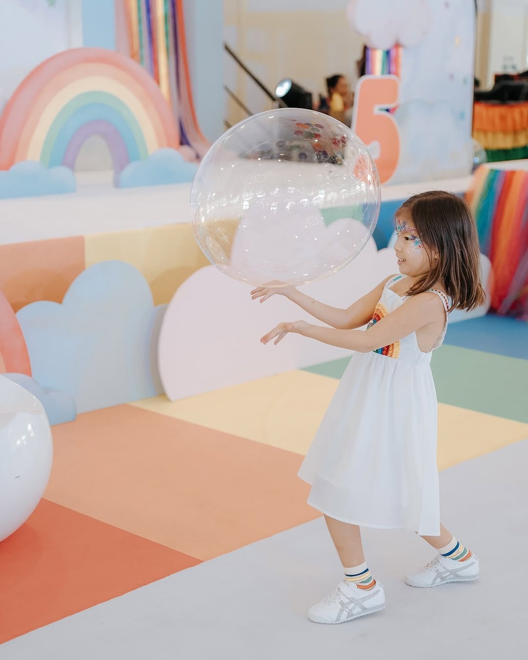 Dahlia's fifth birthday rainbow-themed celebration.